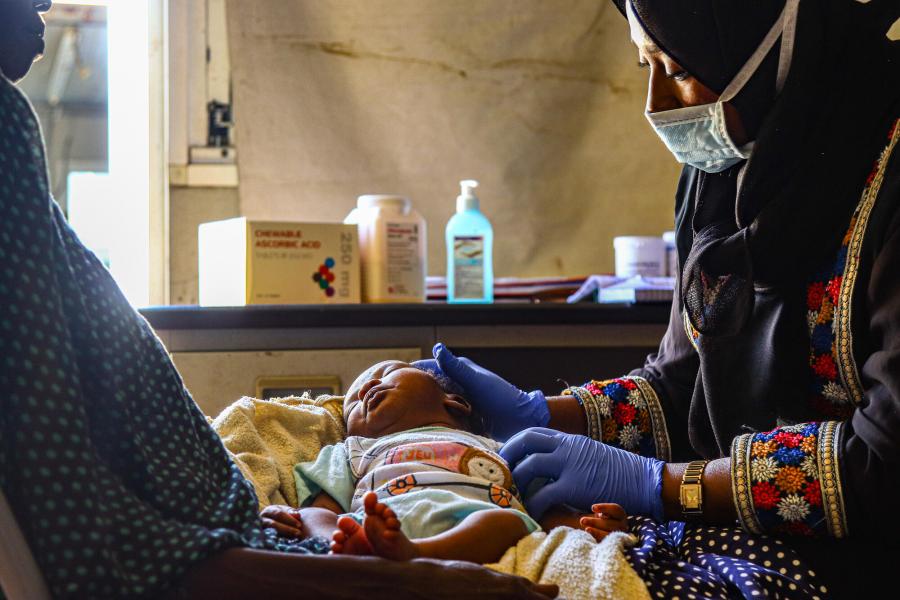 Mother and child at Kalma camp health centre