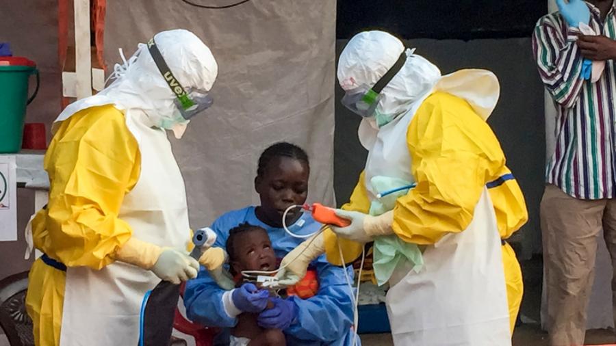 Jariatu, an MSF 'care-giver' looking after a 9mo baby